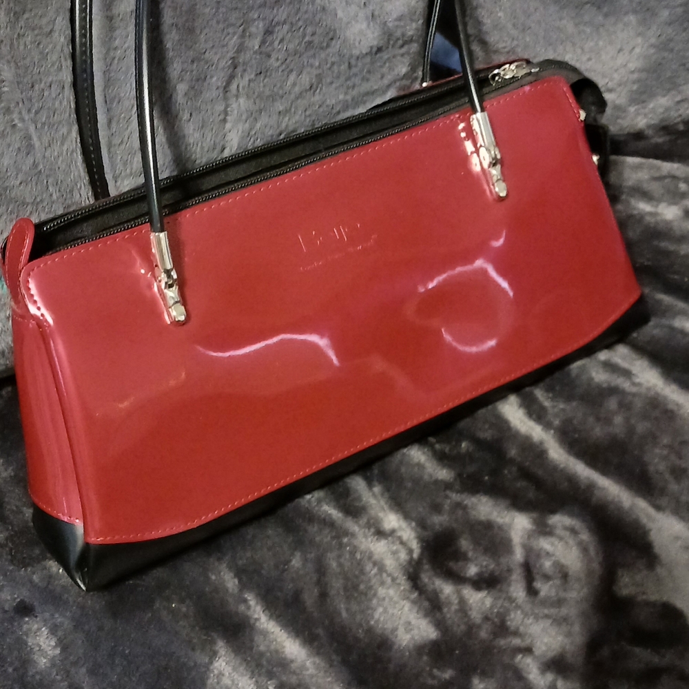 Beijing London, Paris, New York Red Black trimmed patent shoulder bag.